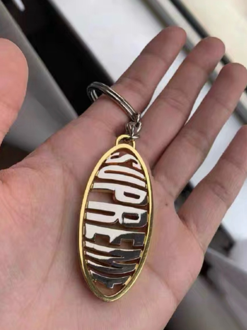 Supreme Gold and Silver Oval Logo Keychain